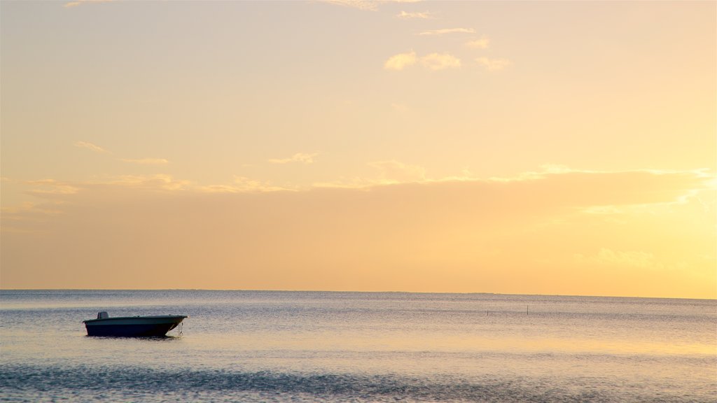 Matira Beach showing general coastal views and a sunset