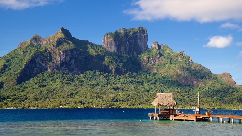 Mt. Otemanu which includes tropical scenes, mountains and general coastal views