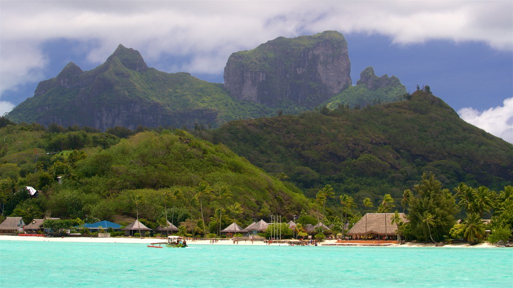 Matira Point featuring tropical scenes, mountains and general coastal views