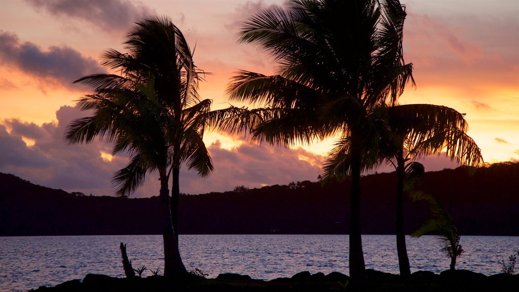 Vaitape Harbor which includes general coastal views and a sunset