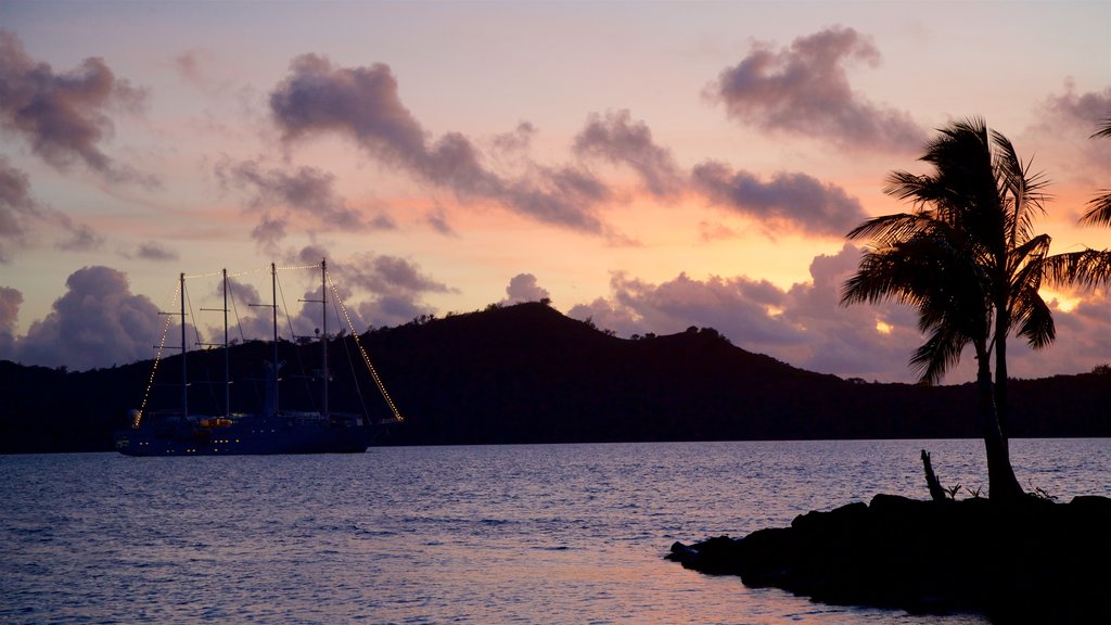 Vaitape Harbor showing general coastal views and a sunset