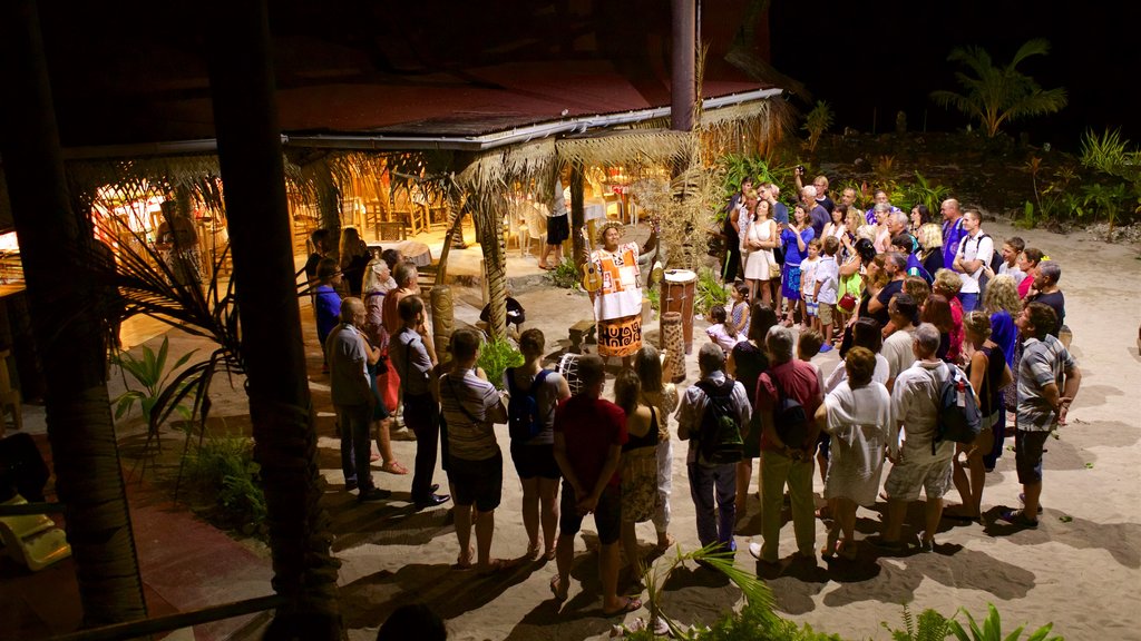 Tiki Village Cultural Centre showing night scenes, performance art and music