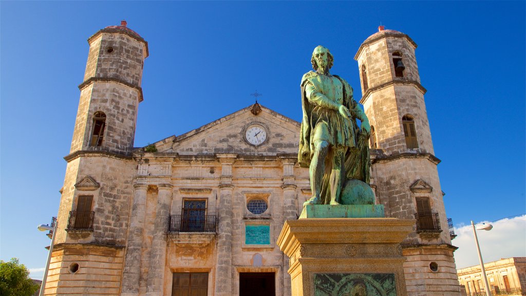 Cardenas Cathedral which includes heritage architecture and a statue or sculpture