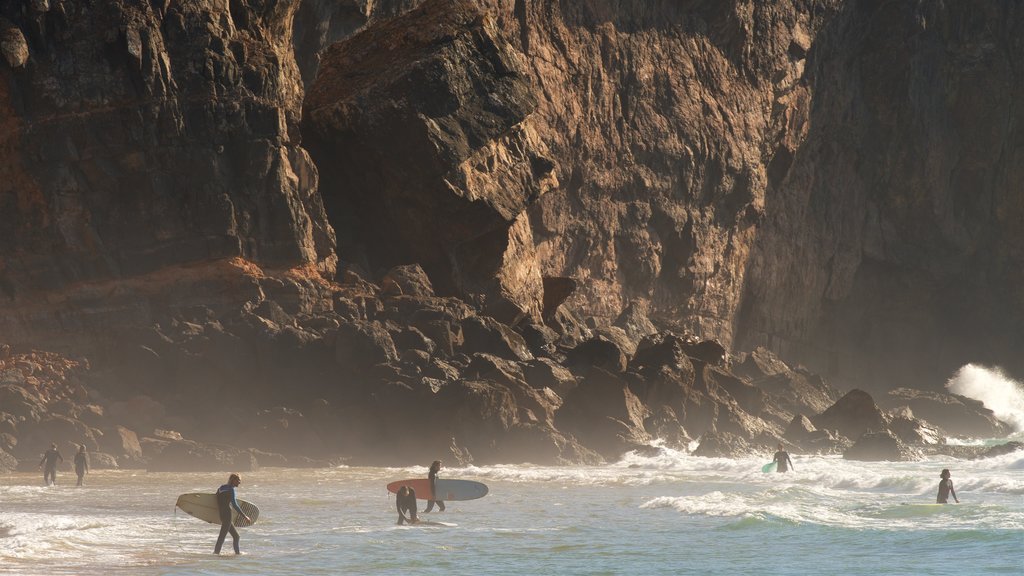 Tonel Beach featuring rugged coastline, waves and surfing