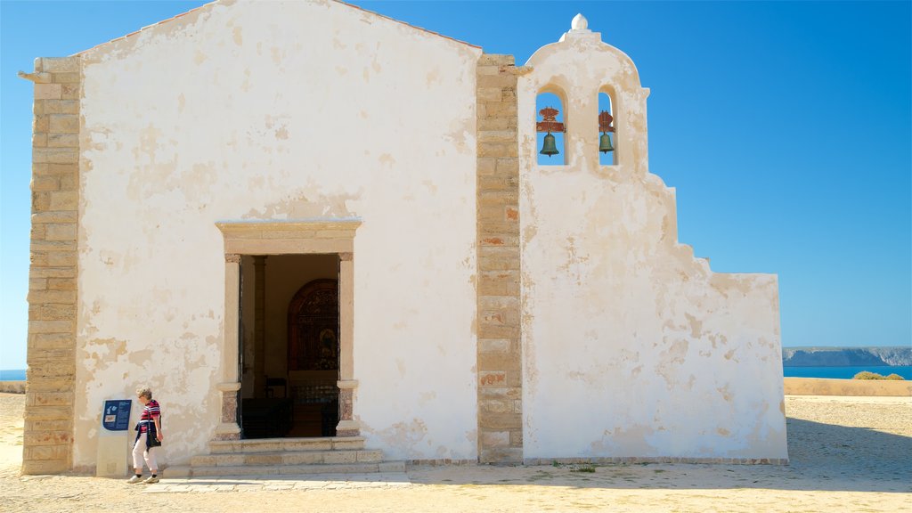 Sagres Fortress showing heritage elements as well as an individual femail