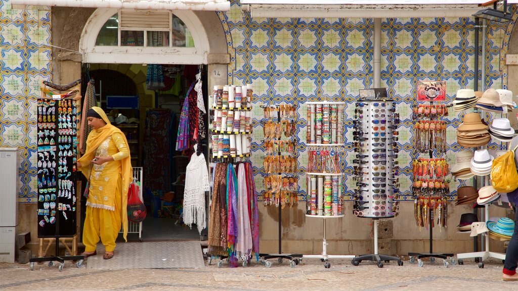 Tavira which includes markets as well as an individual female