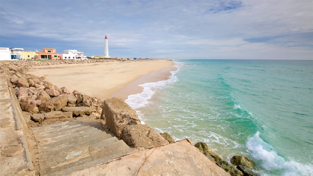 Strand van Faro inclusief een zandstrand en algemene kustgezichten