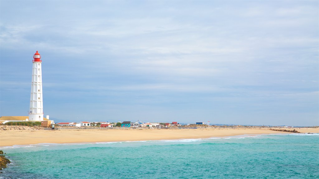 Faro Island Beach which includes general coastal views, a lighthouse and a sandy beach