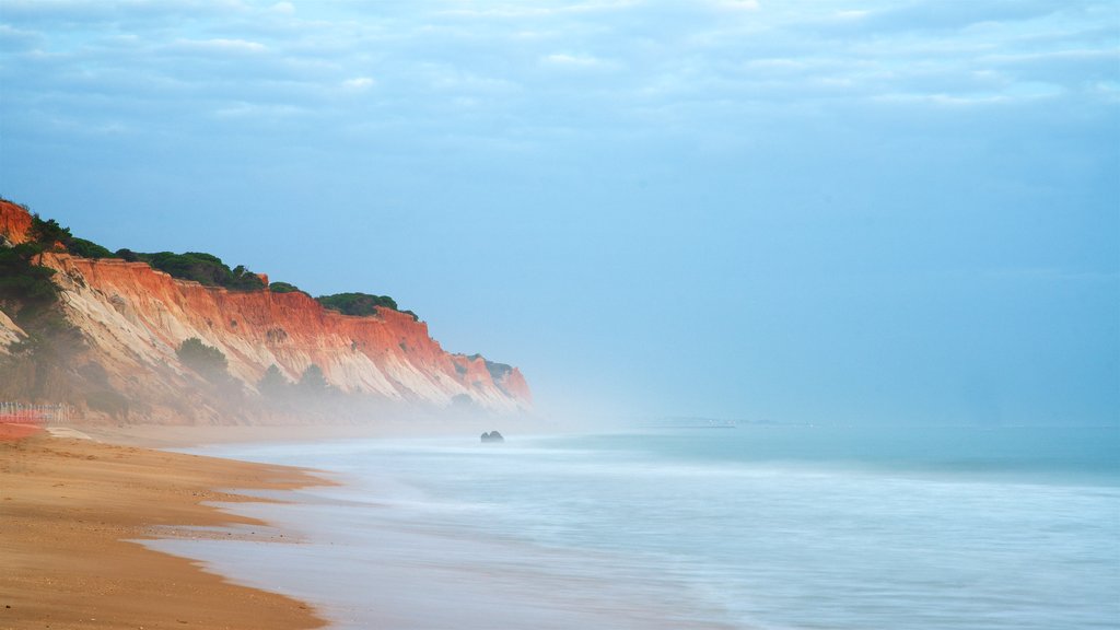 Falesia Beach which includes general coastal views, a sandy beach and rocky coastline