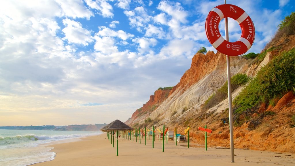 Falesia Beach showing a sandy beach, rocky coastline and general coastal views