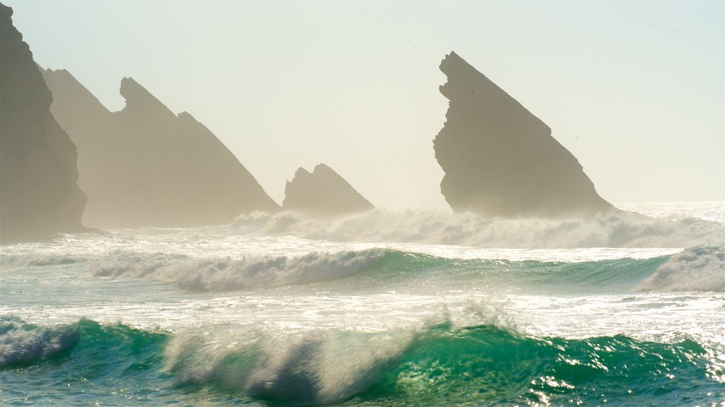 Adraga Beach showing waves, general coastal views and rocky coastline