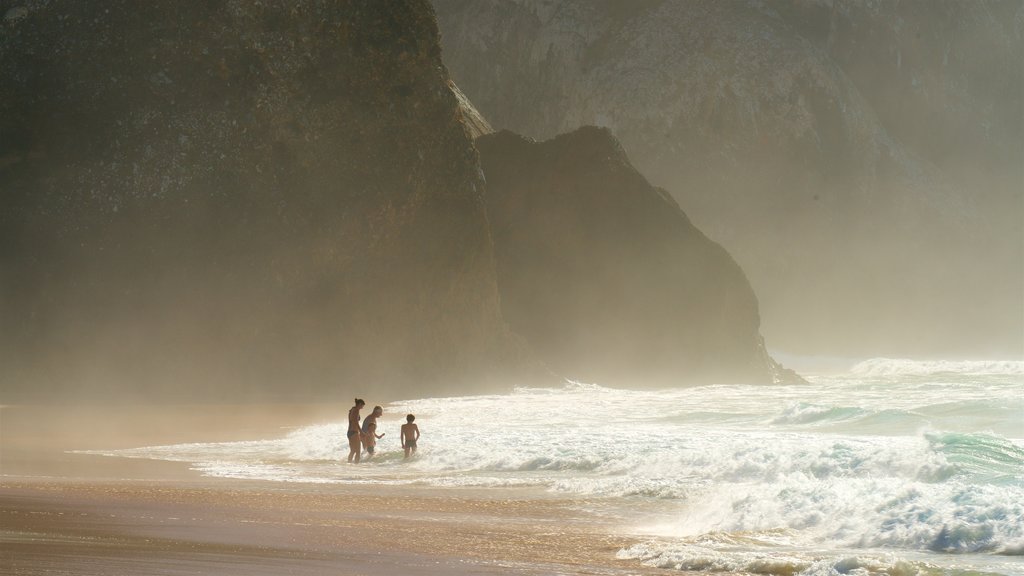 Adraga Beach showing surf, general coastal views and rugged coastline