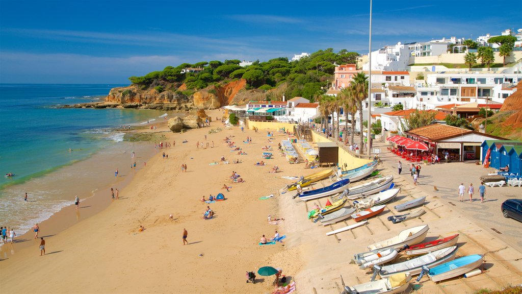 Olhos D\'Agua Beach which includes a coastal town, general coastal views and a beach