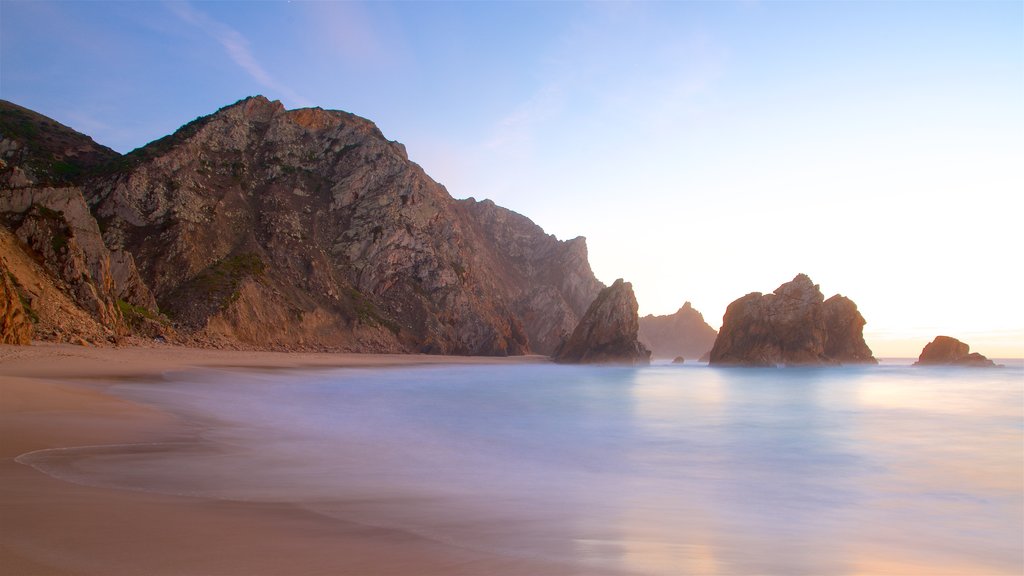 Ursa Beach which includes rugged coastline, a sunset and general coastal views