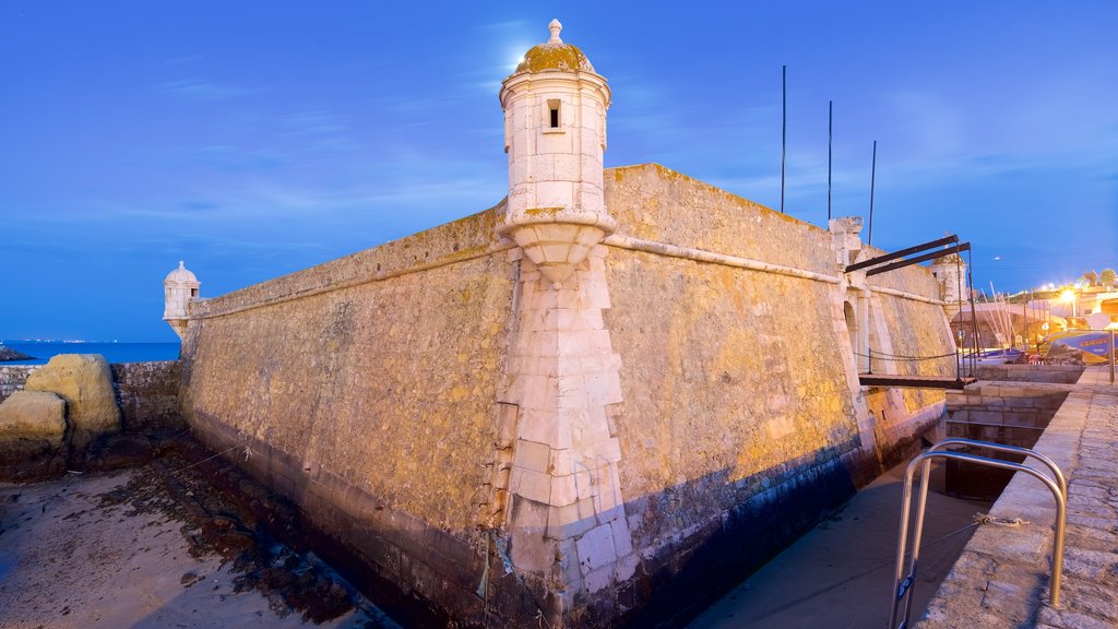 Lagos which includes night scenes and heritage elements