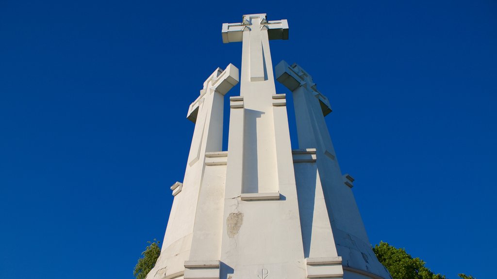 Three Crosses featuring a monument and religious elements