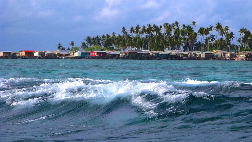 Mabul Island which includes surf and general coastal views