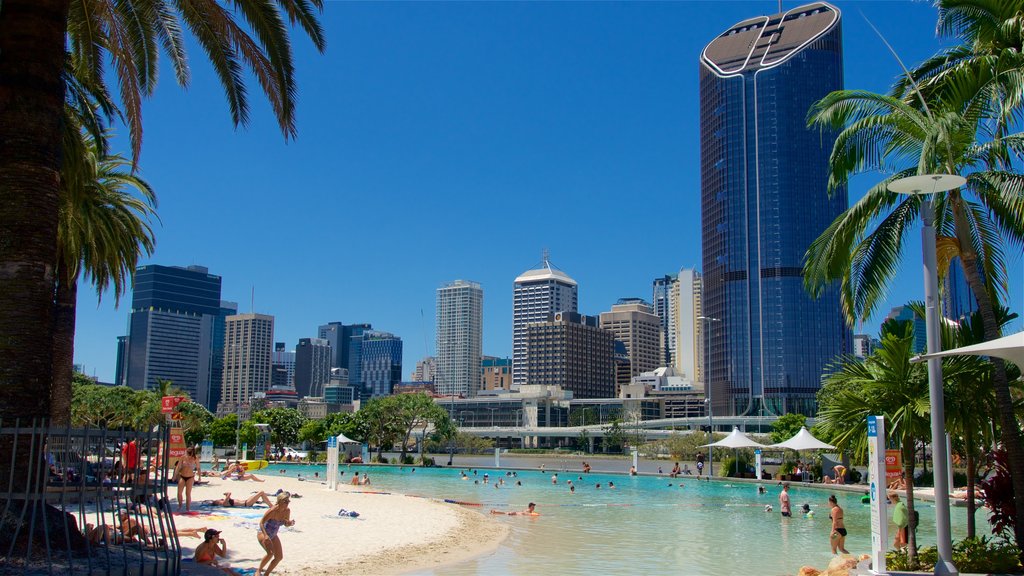 Southbank Parklands showing swimming, a city and a high-rise building