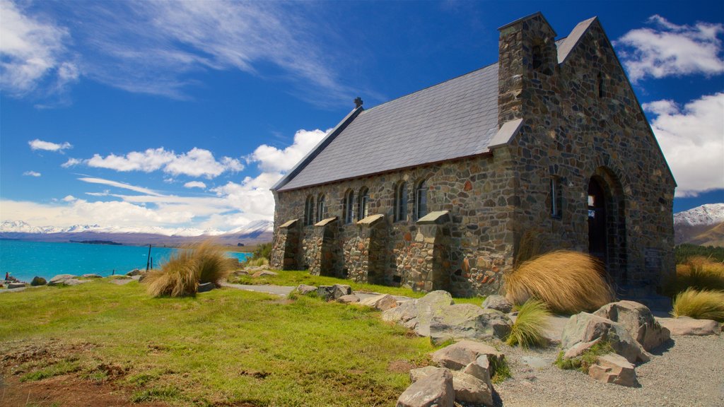 Church of the Good Shepherd que incluye un lago o espejo de agua, una iglesia o catedral y elementos patrimoniales