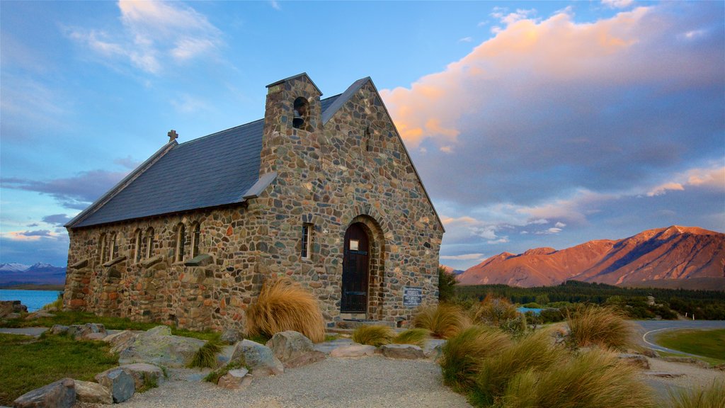 Church of the Good Shepherd showing a sunset, a church or cathedral and mountains