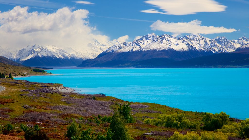 Lake Pukaki showing snow, a lake or waterhole and tranquil scenes