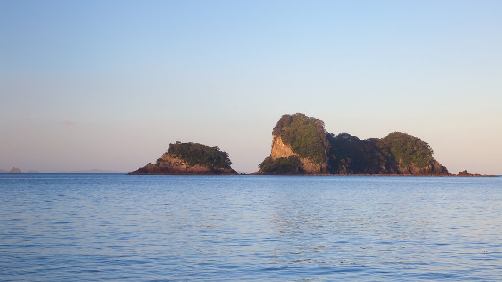 Cathedral Cove Beach which includes island images, a sunset and general coastal views