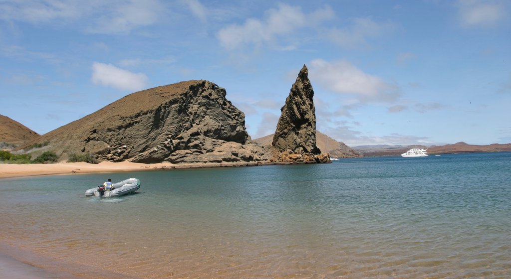 Bartolome Island showing rocky coastline, general coastal views and boating