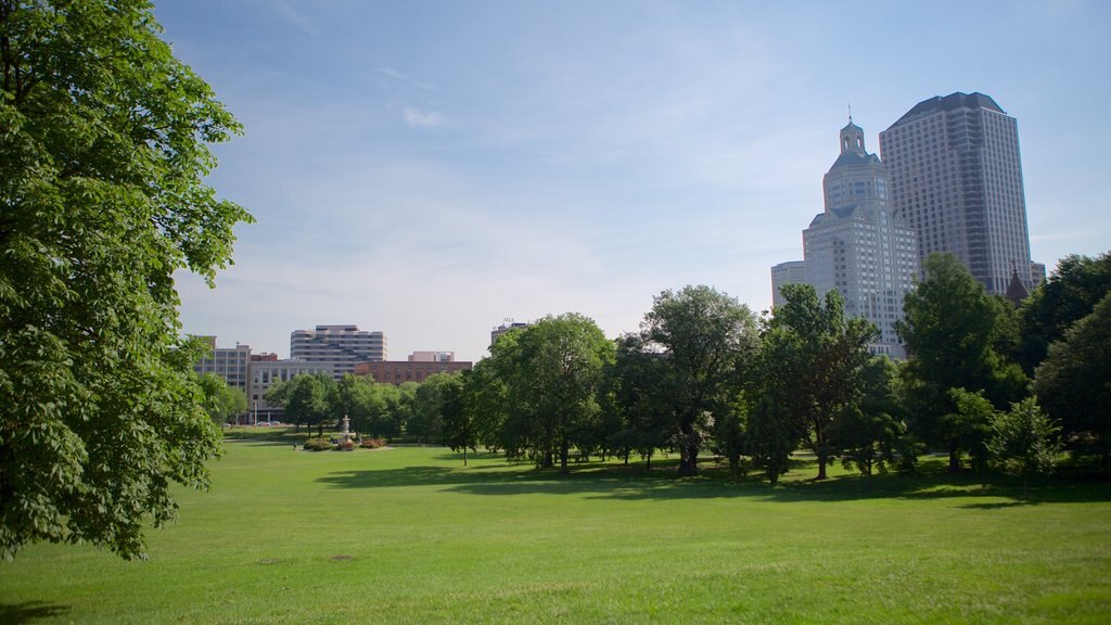 Bushnell Park which includes a city, a garden and a skyscraper