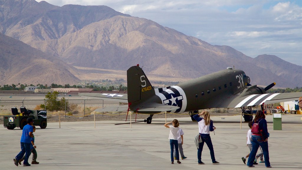 Palm Springs Air Museum showing heritage elements as well as a small group of people