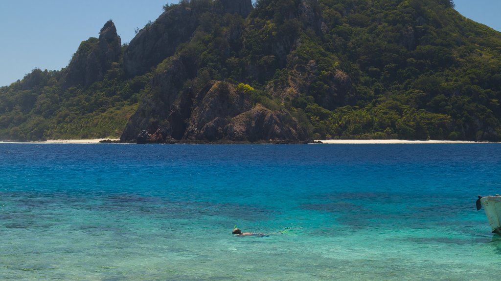 Mamanuca Islands showing island views, a beach and general coastal views