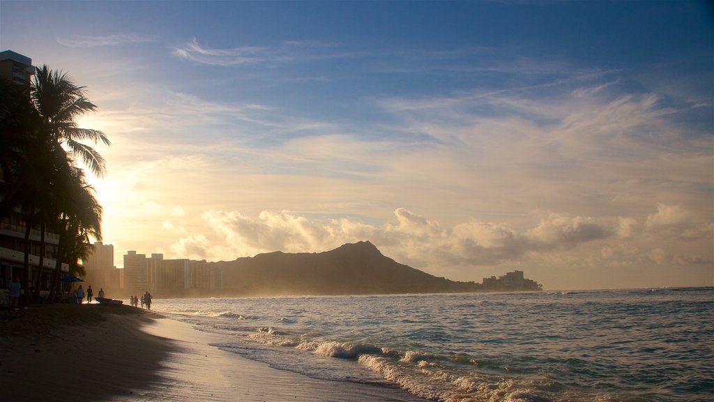 Waikiki Beach which includes a sunset, surf and general coastal views