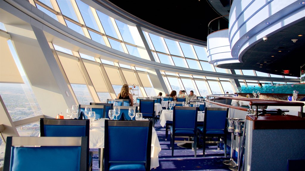 Stratosphere Tower showing dining out and interior views as well as a small group of people