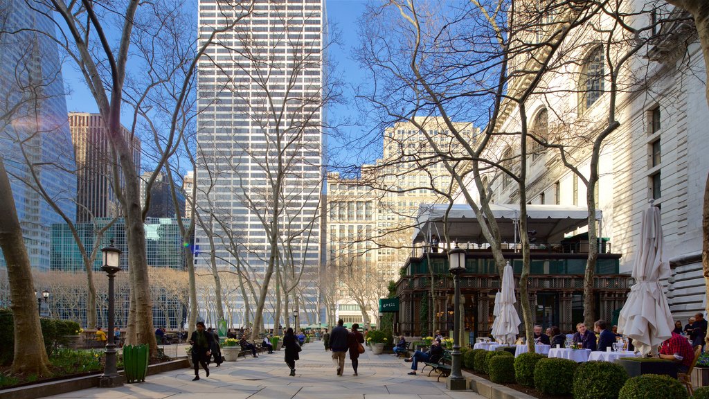 Bryant Park featuring a skyscraper, a city and outdoor eating