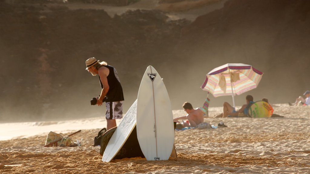 Makena Beach State Park which includes general coastal views, a sunset and a beach