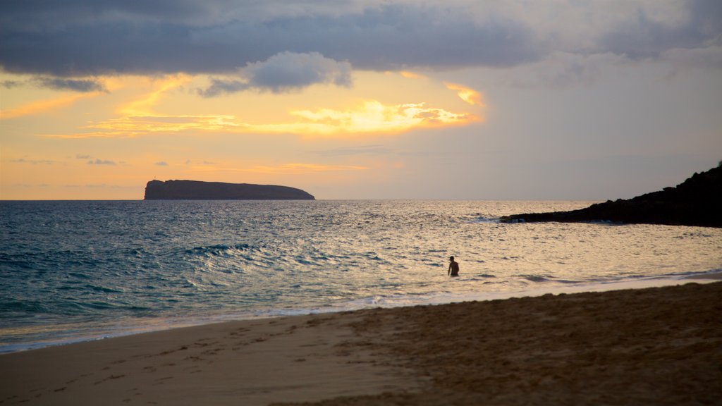 Makena Beach State Park which includes a beach, general coastal views and a sunset