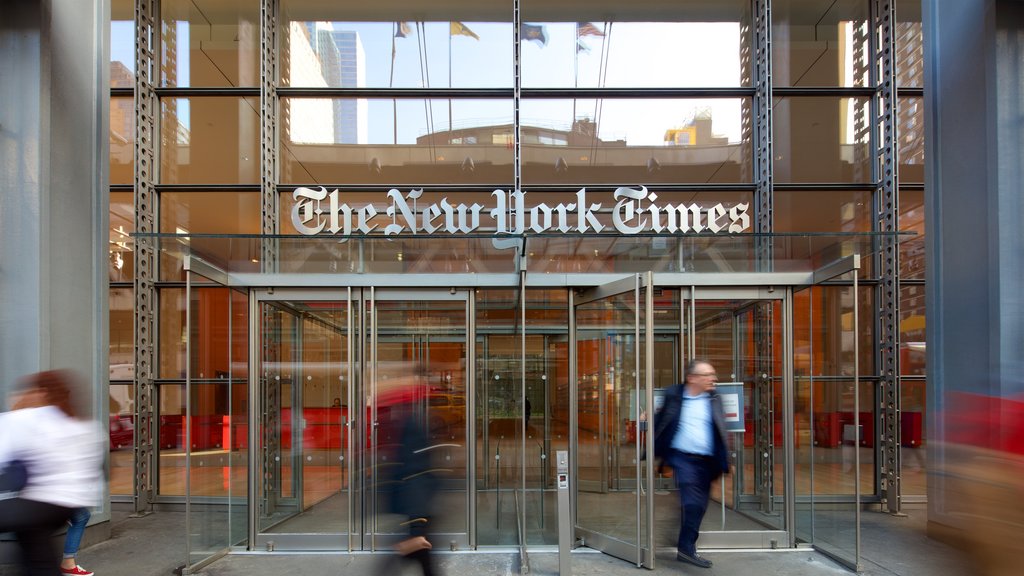 New York Times Building featuring a city and signage