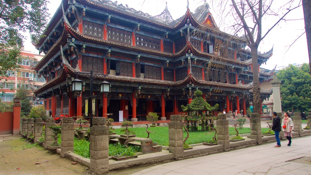 Wenshu Monastery featuring heritage architecture and a garden as well as a couple