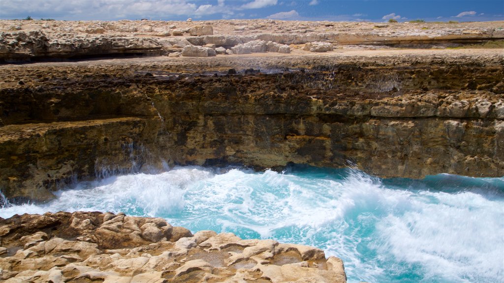 Devil\'s Bridge showing surf, general coastal views and rugged coastline