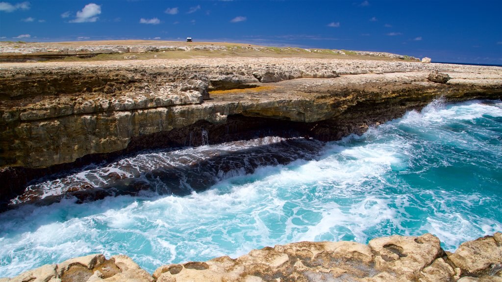 Devil\'s Bridge which includes general coastal views, surf and rugged coastline