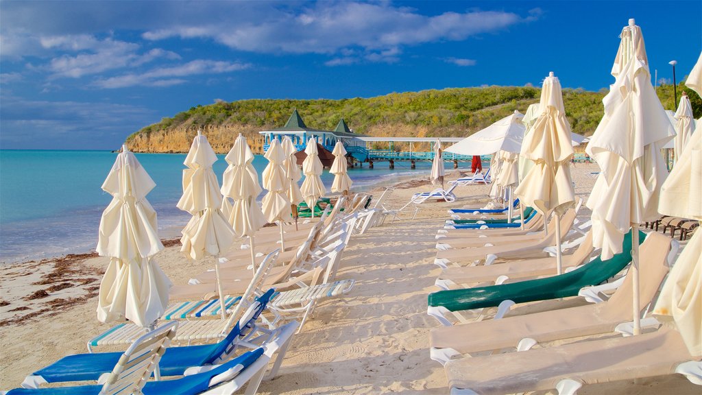 Dickenson Bay Beach showing a sandy beach, tropical scenes and general coastal views