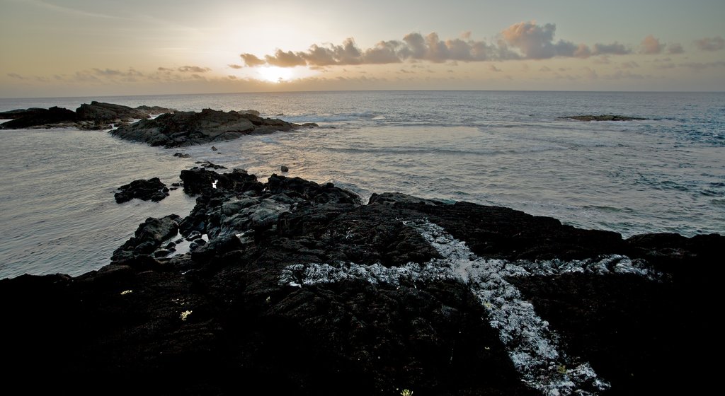 Samoa which includes rocky coastline, general coastal views and a sunset