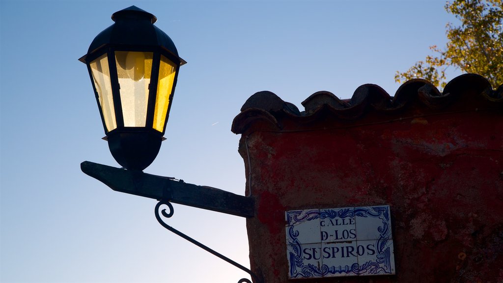 Uruguay showing signage and a sunset