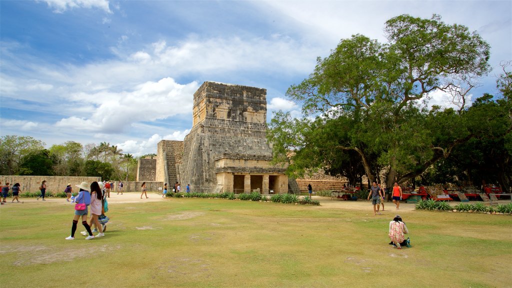 Templo del Barbado & Templo de los Jaguares y Escudos which includes a garden and heritage architecture as well as a small group of people