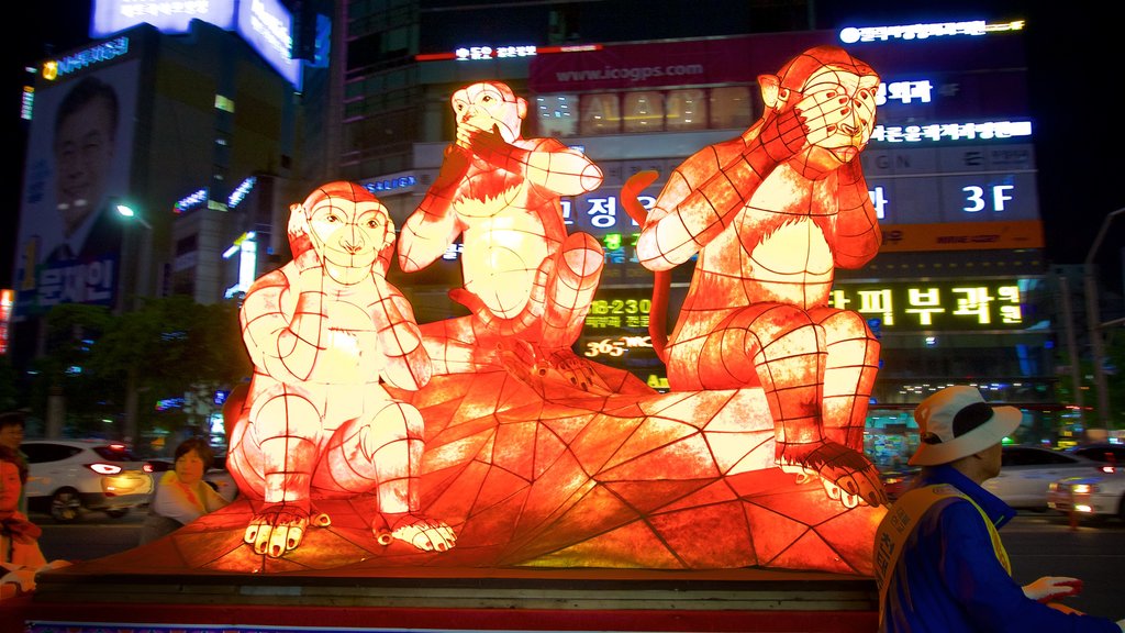 Busan City Centre showing outdoor art and night scenes