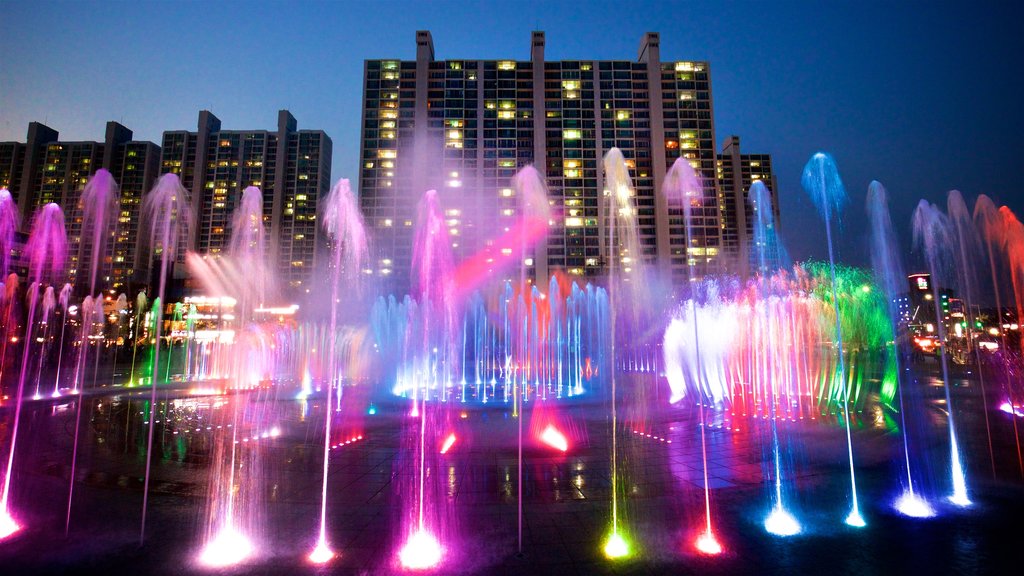 Dadaepo Sunset Fountain of Dream showing night scenes, a city and a fountain