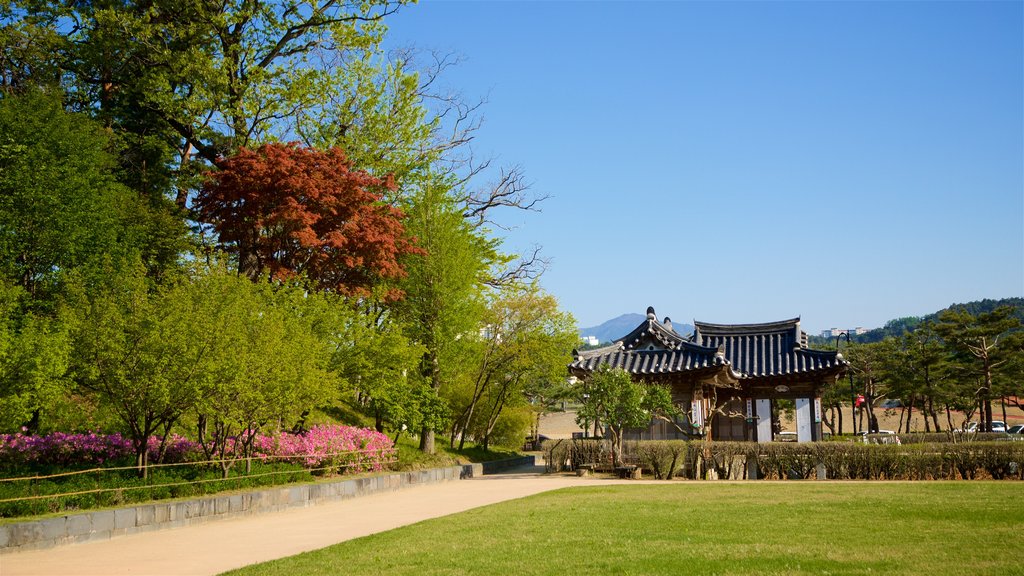 Gangneung Seongyojang House showing wildflowers and a park