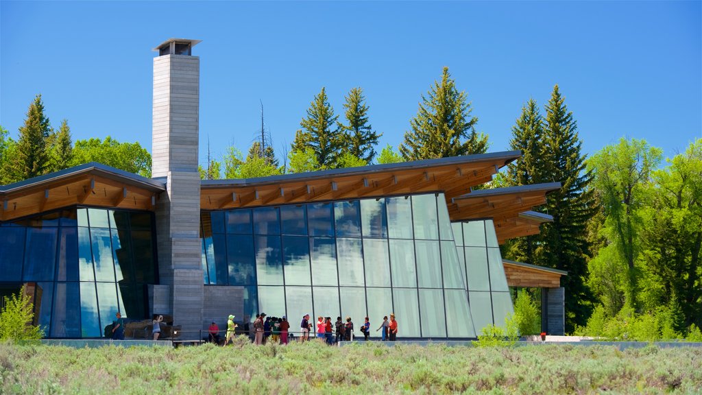 Jenny Lake Visitor Center featuring modern architecture as well as a small group of people