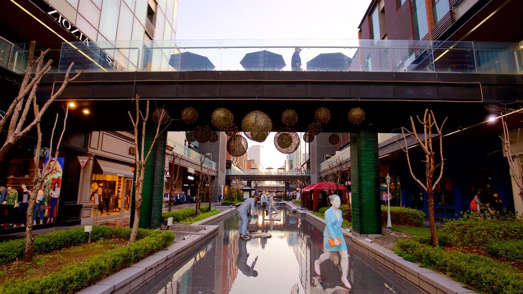 NC Cube Canal Walk showing outdoor art, city views and a city