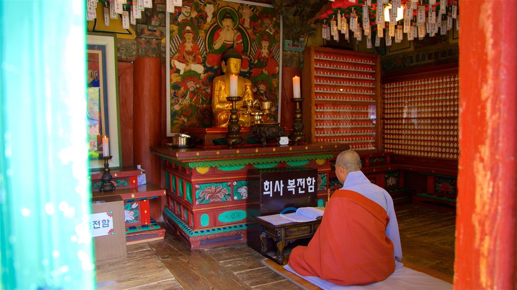 Jeondeungsa Temple which includes a temple or place of worship, a day spa and interior views