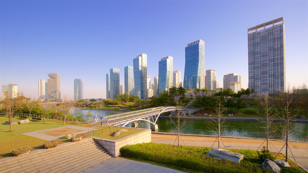 Songdo Central Park which includes landscape views, a city and a river or creek